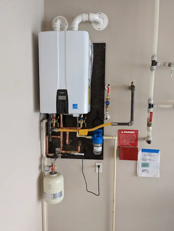 Professional plumber installing copper piping in a Toronto home